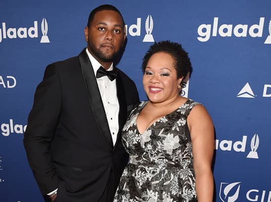Yamiche Alcindor with her husband at a red carpet event