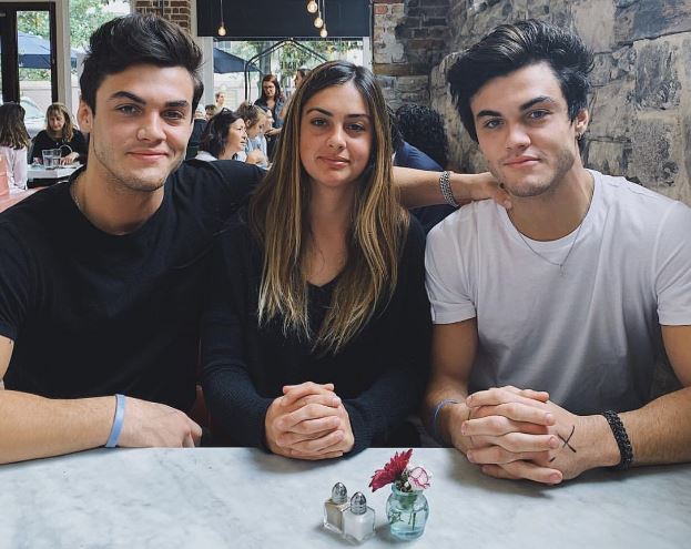 Cameron Dolan (in the middle) with her twin brothers Grayson and Ethan