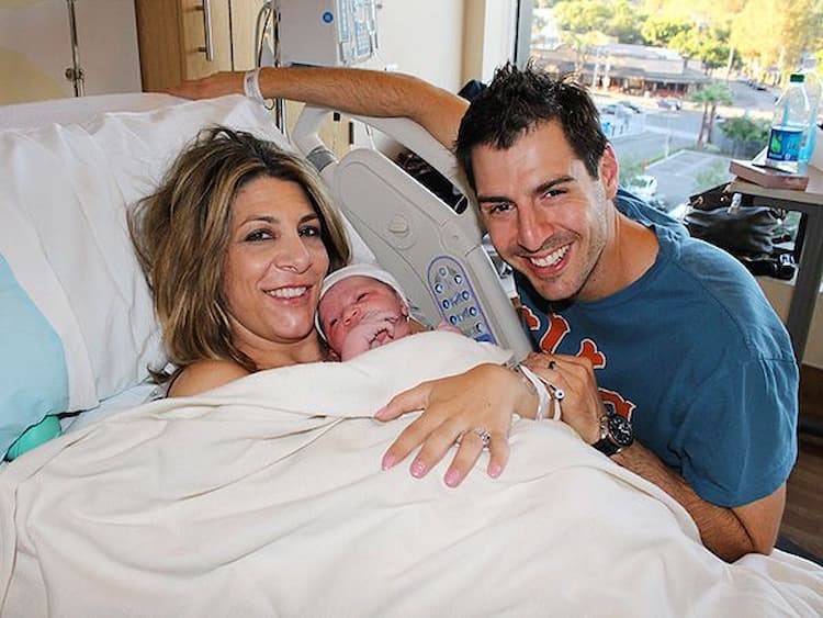 Rob Cesternino, his wife Nicole Palmeri and their child